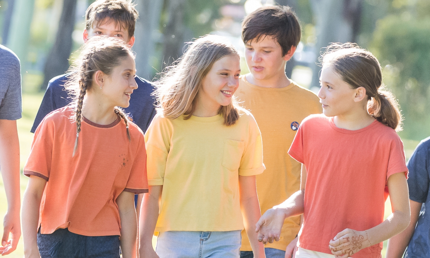 A group of school children are out for a walk in their casual dress at school