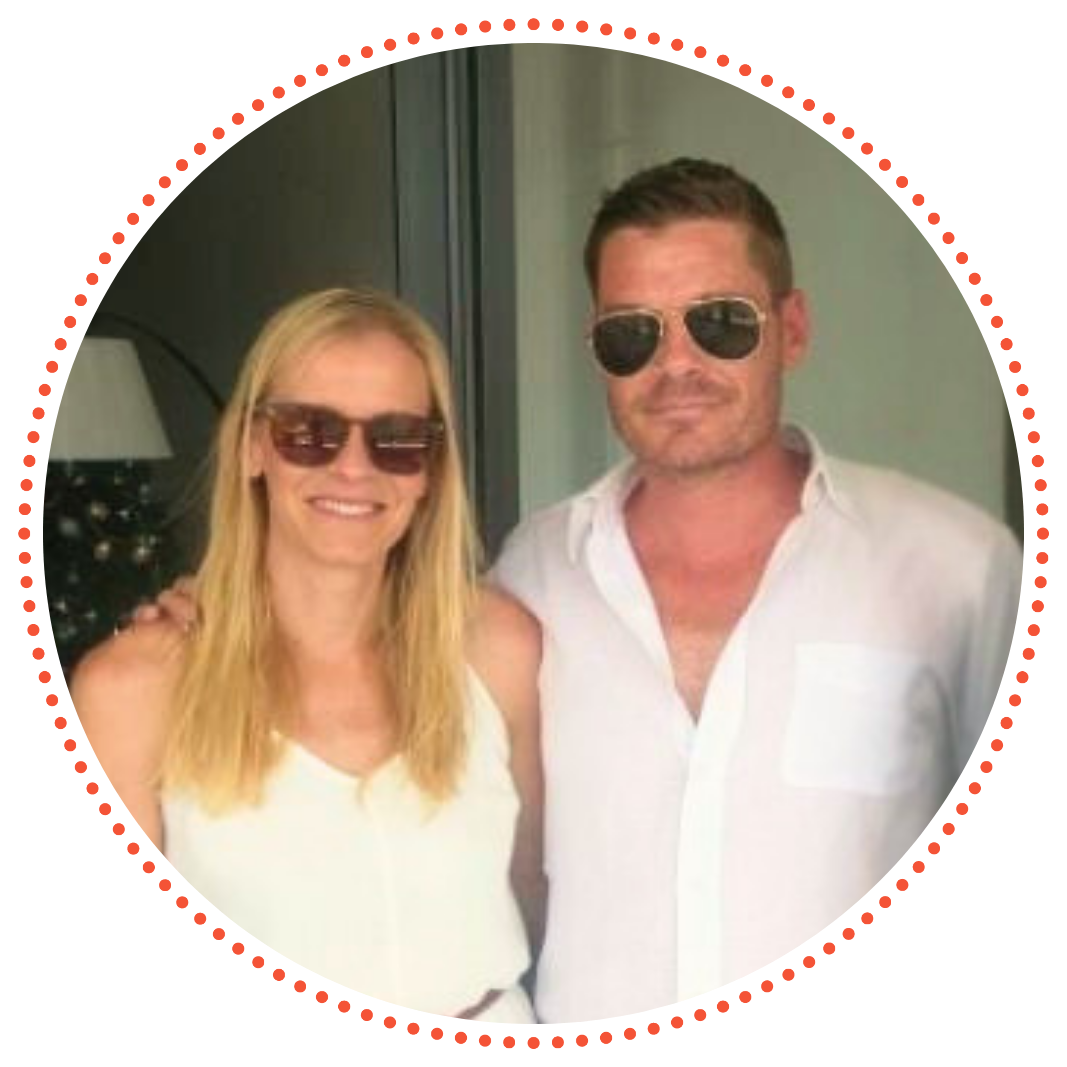 Lauren and her brother Mat are wearing sunglasses and smiling together for a photo outdoors. Mat has his arm around Lauren.